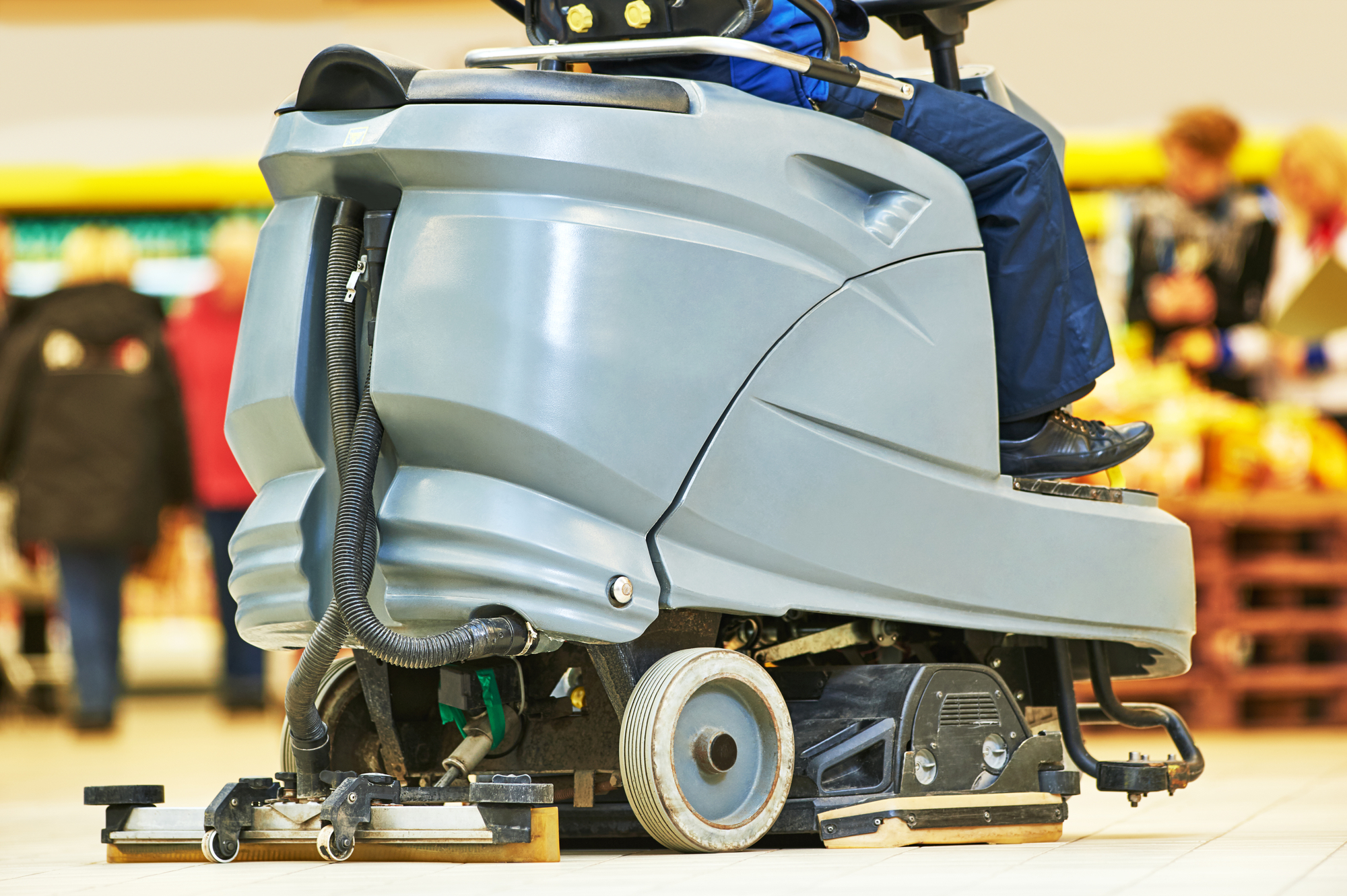 Floor care and cleaning services with washing machine in supermarket shop store