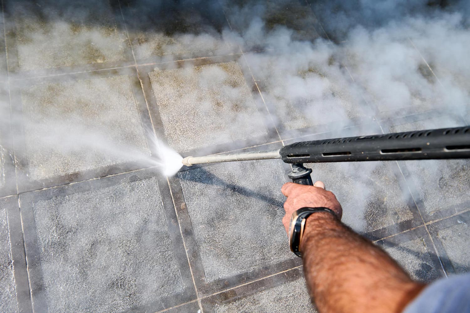 Cleaning concrete paving stones